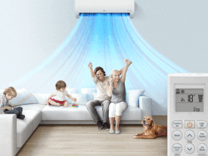 Điều hoà LG V18WIN 1 chiều 18000 BTU 6 "Một gia đình ngồi trên một chiếc ghế dài trong phòng khách với máy điều hòa không khí LG được lắp đặt phía trên họ. Các đường không khí màu xanh lam đang đi ra cho biết máy đang bật. Ở tiền cảnh là mặt trước của điều khiển từ xa hiển thị các nút và nhiệt độ."